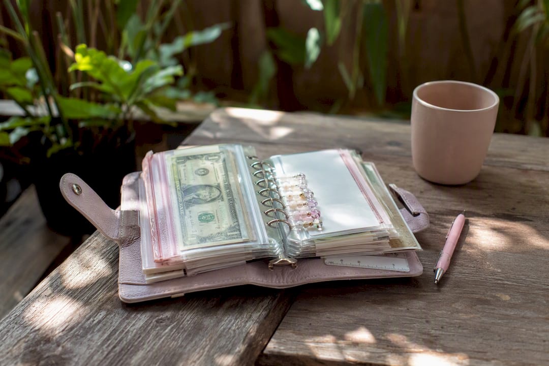 Open A6 binder with cash envelopes and paper clips