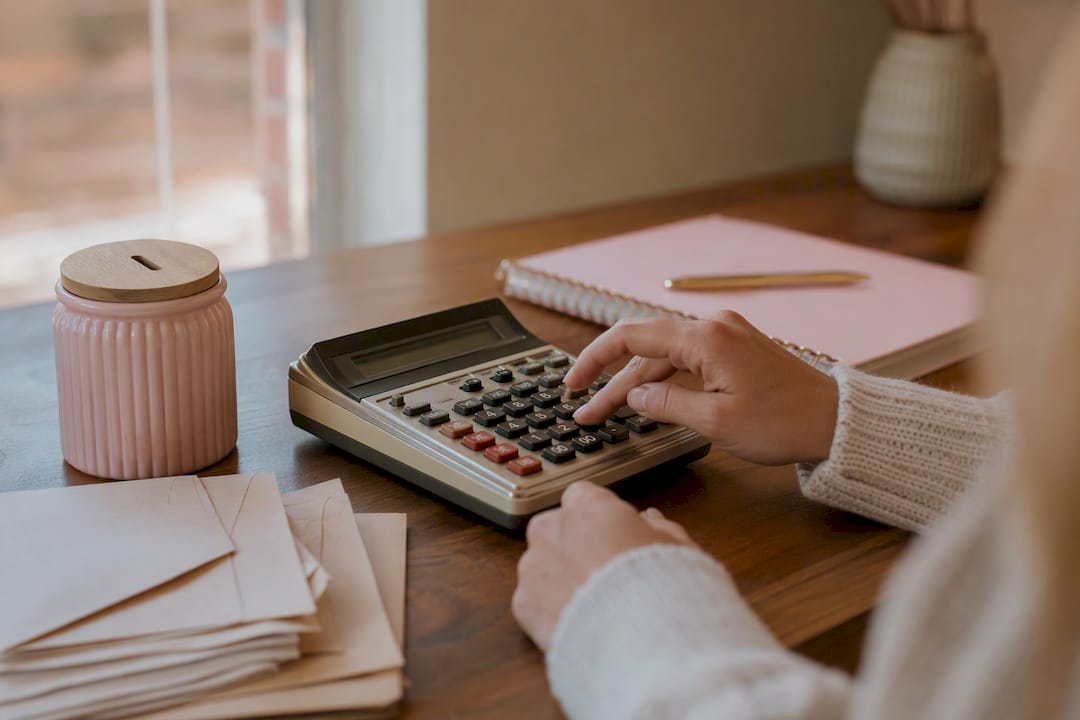 Hands calculating savings challenge setup